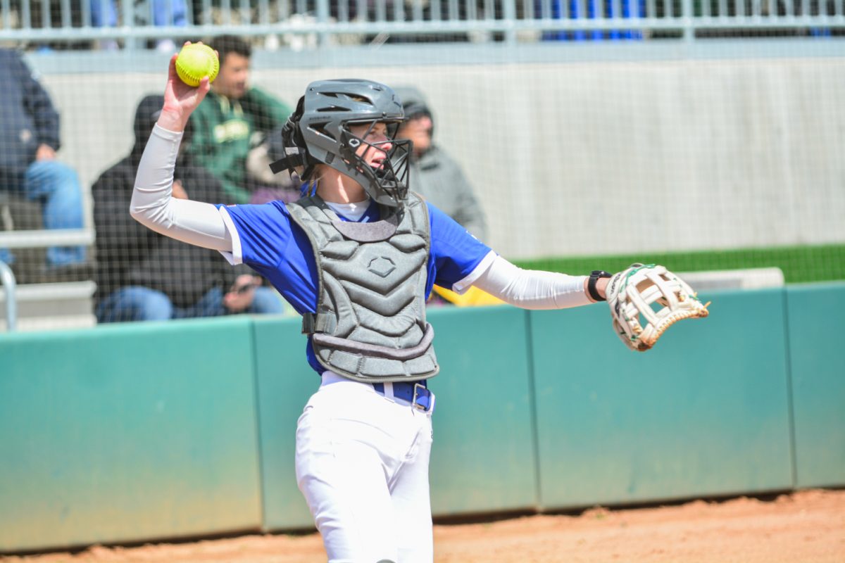 Brooke Bohlender throwing the ball back to the pitcher after a throw April 5. Brooke Bohlender played as the teams catcher against San Diego State.