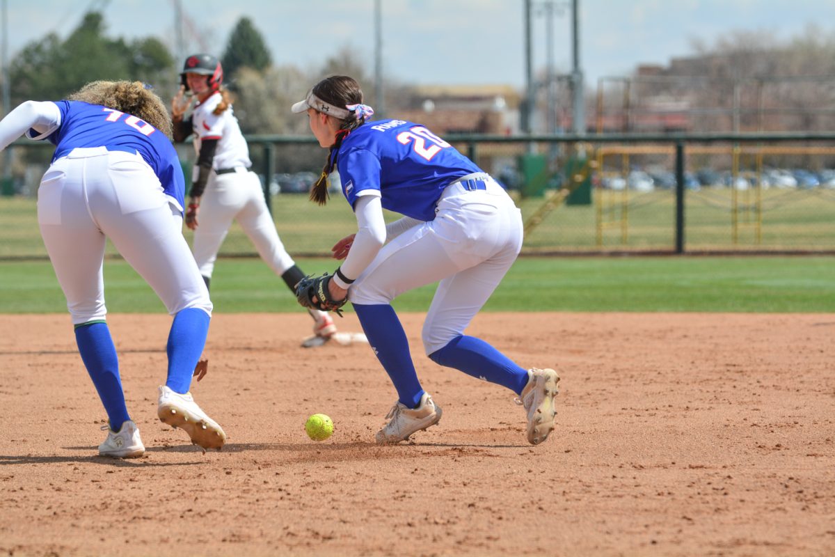 Jordan West and Jailey Wilson fighting for the ball on the field against San Diego State April 5. They fought to get a San Diego State player out however was too late.