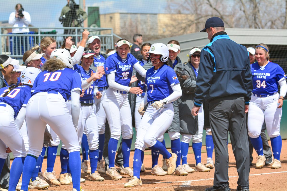 Autumn Rutherford celebrates her home run with her teammates April 5. Rutherford hit her home run against San Diego State University and led her team to a win with a score of 2-1.