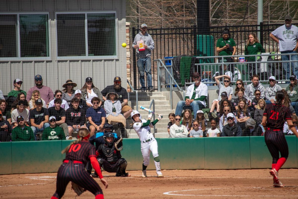 Kaylynn English (28) swings at the ball during the match against San Diego State University April 6.