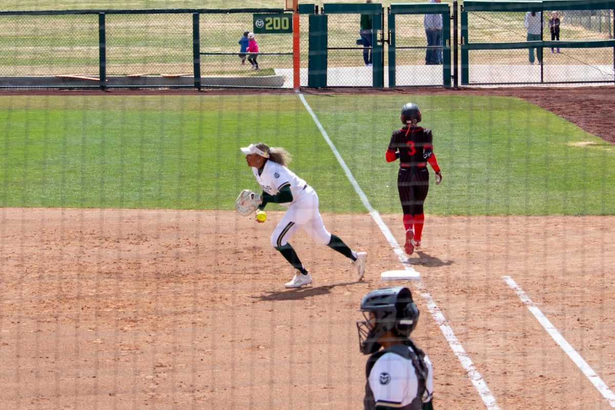 Jailey Wilson (10) catches the ball at first base during the match against San Diego State University April 6.