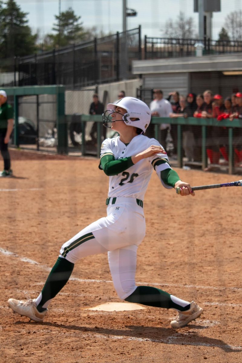 Jordan West (20) swings during the match against San Diego State University April 6.