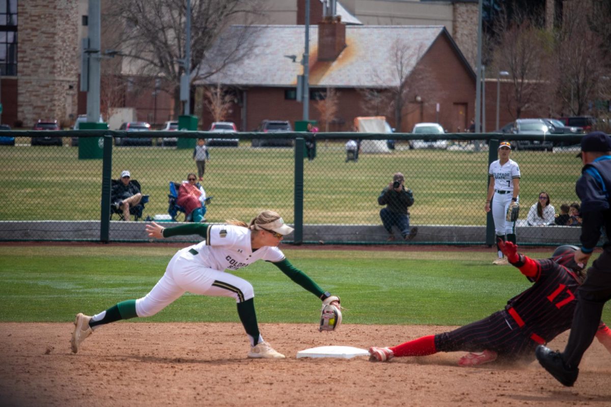 Kaylynn English (28) tries to tag a player out at second base during the match against San Diego State University April 6.