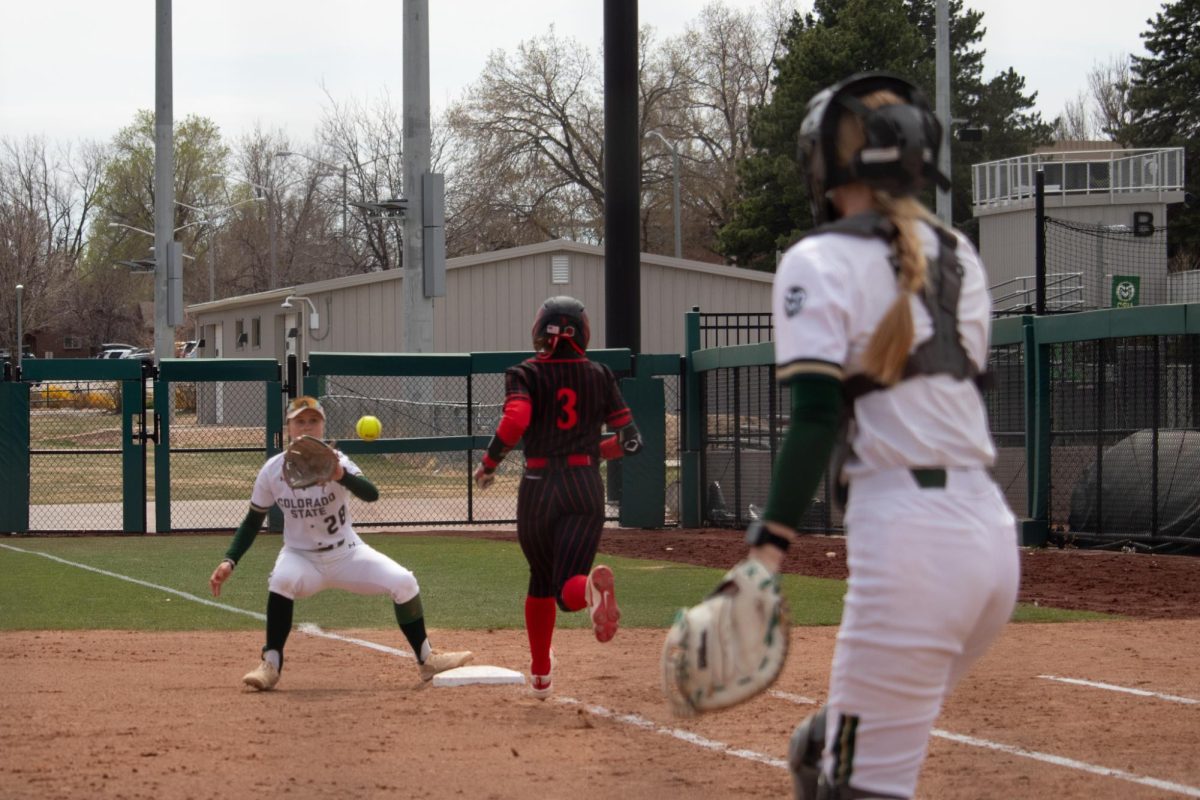 Kaylynn English (28) catches a ball at first base to get an out during the match against San Diego State University April 6.