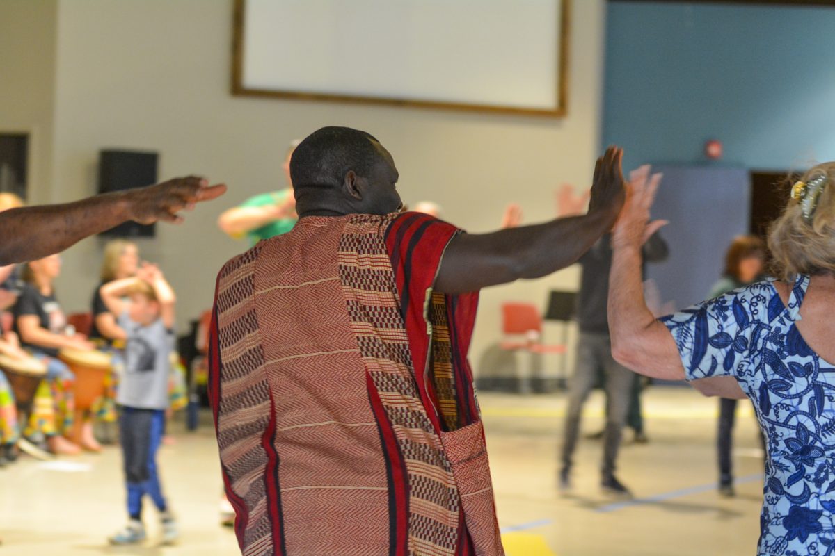 The dance instructor leading the crowd in traditional dances April 12. These dances were performed at the Francophone Music Festival. 