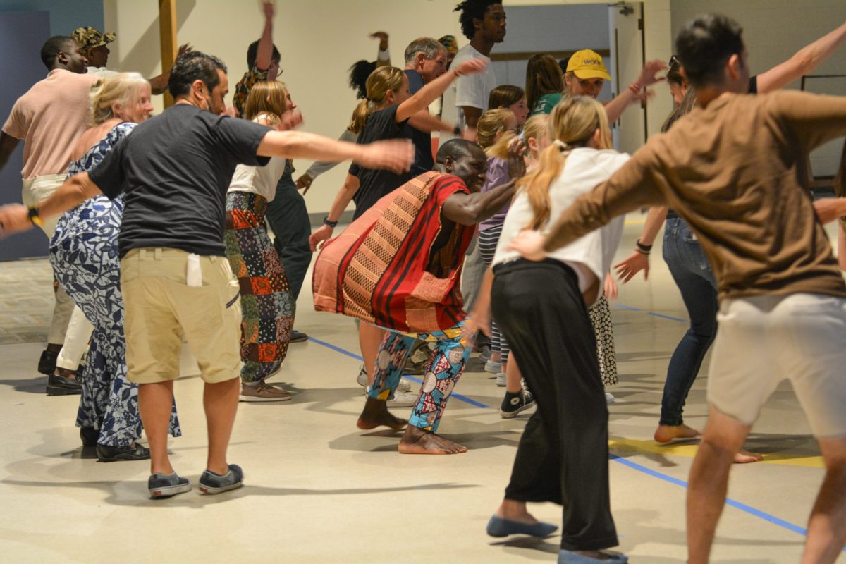 The crowd being led by the instructor dancing to traditional music April. 12. The Francophone African Festival showcased music, food and fashion. 