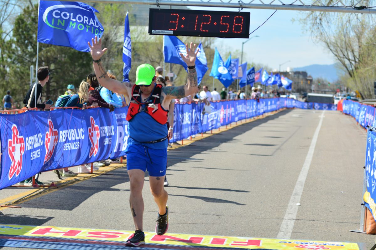A runner crossing the Horsetooth Half Marathon after running 13.1 miles April 13. 