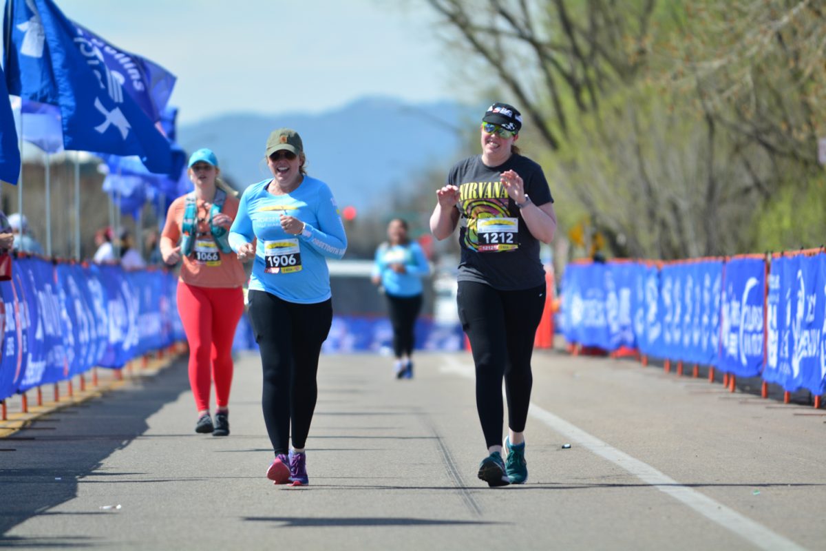 Trystan McCaughey and Taryn Tometich running the final stretch of the Horsetooth Half Marathon April 13. These girls finished with a huge smile after running 13.1 miles. 
