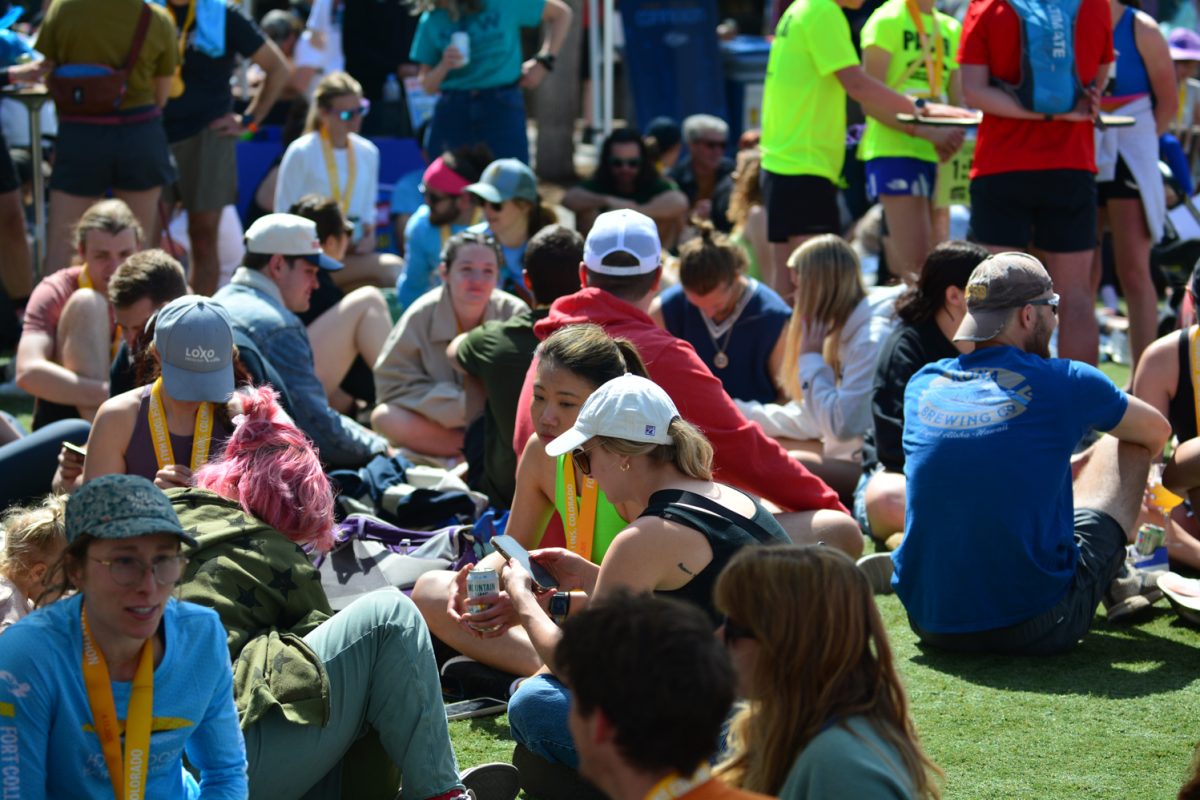 Runners surrounded by friends and family celebrate completing the Horsetooth Half Marathon April 13. This celebration was held at New Belgium Brewing company. 