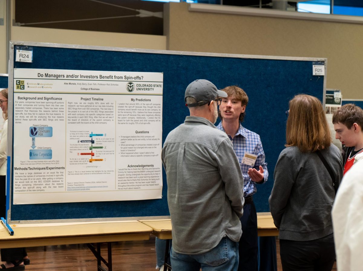 Alex Munsie explains his project to CURC attendees on April 17. 