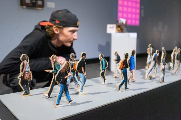 Image of a person looking at artwork.