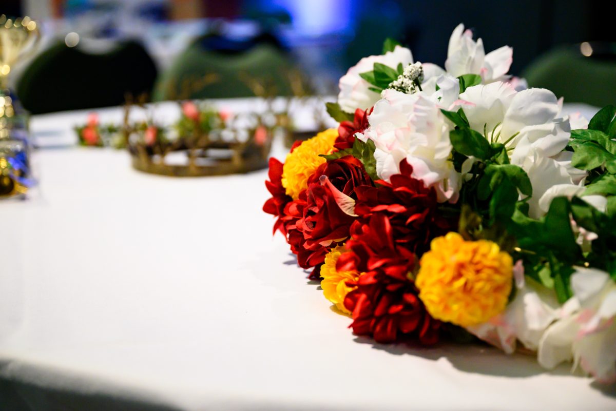 A decorative bouquet of flowers sits on a table during setup for Queer Prom April 25. Hosted by the Colorado State University Pride Resource Center, this year's Queer Prom theme was "Night at the Museum."
