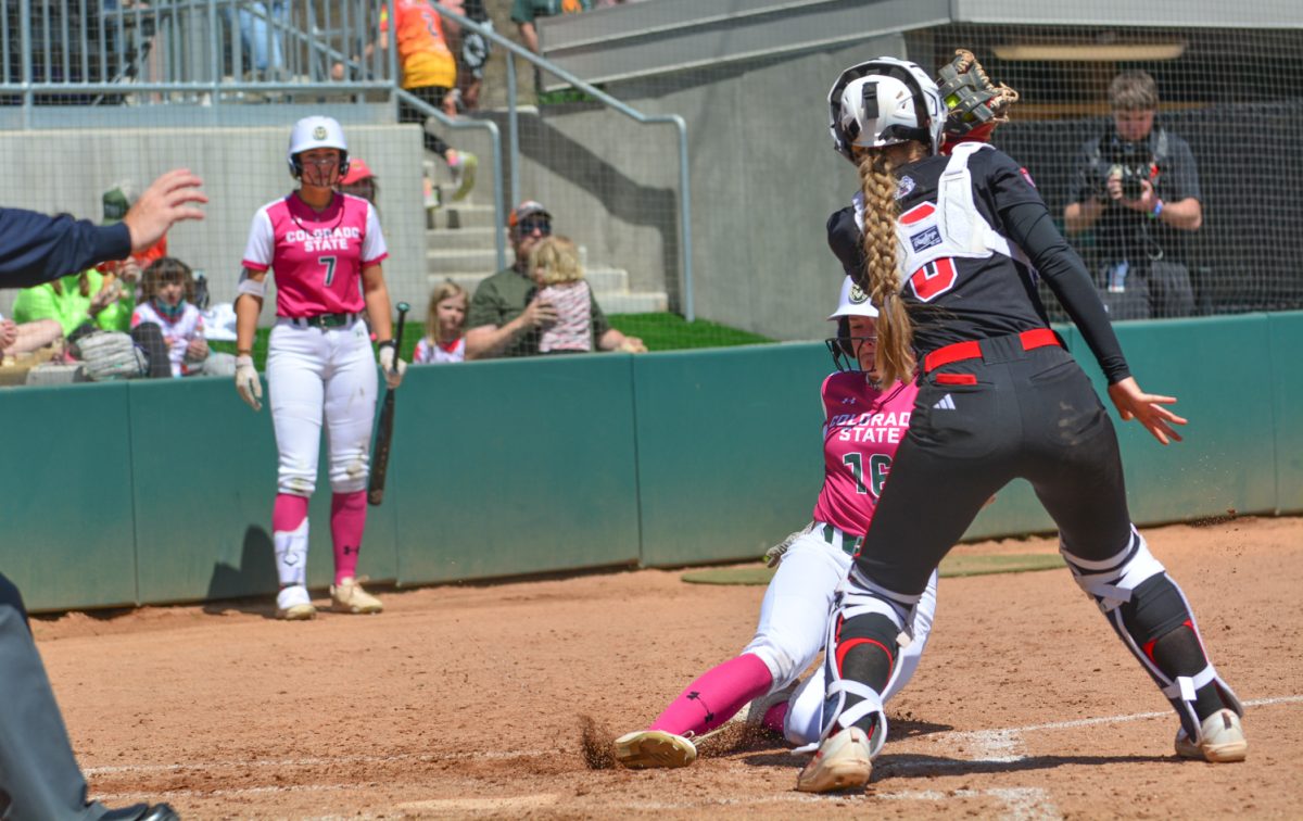 Lauren Stucky sliding into home base scoring a point for Colorado State April 26. Lauren and her teammates defeated Fresno State during their game of their double header. 
