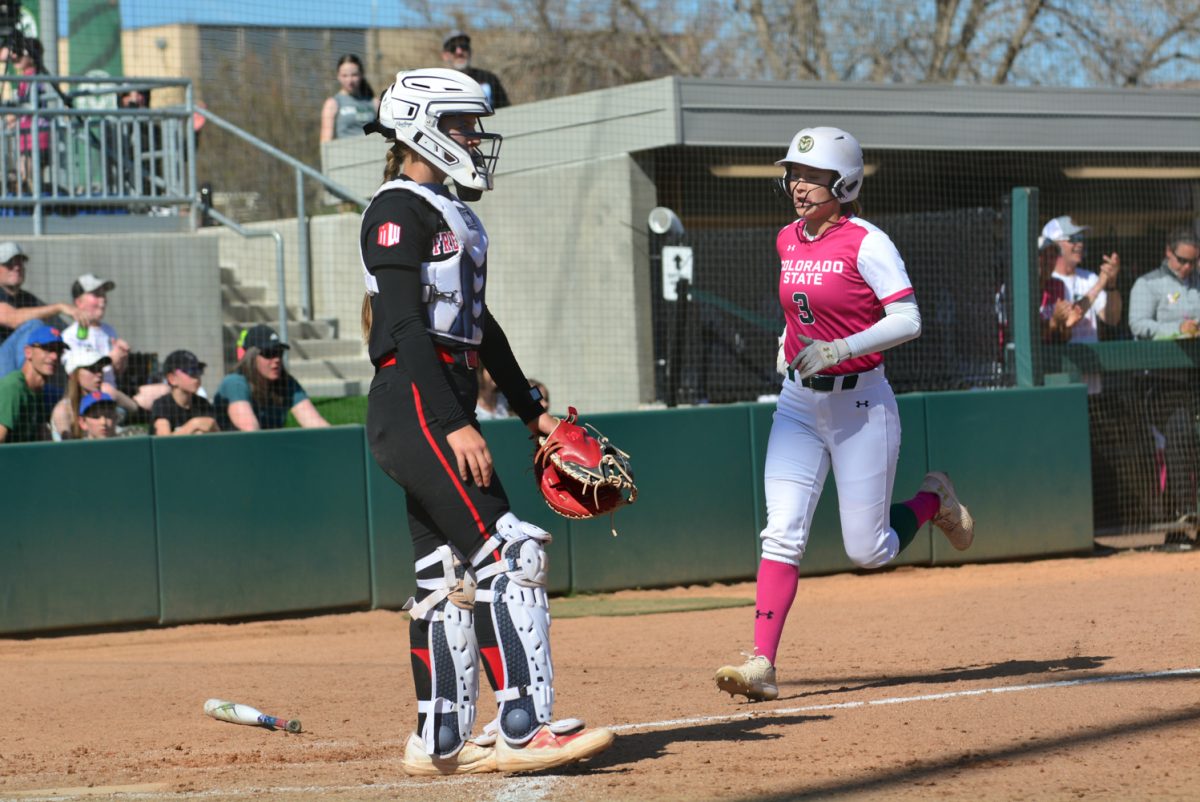 Carolina Buffaloe running to home base to score a point after her teammate hit against a Fresno State player April 26. Carolina and her teammates unfortunately lost the second game against Fresno State with a score of 8-3.
