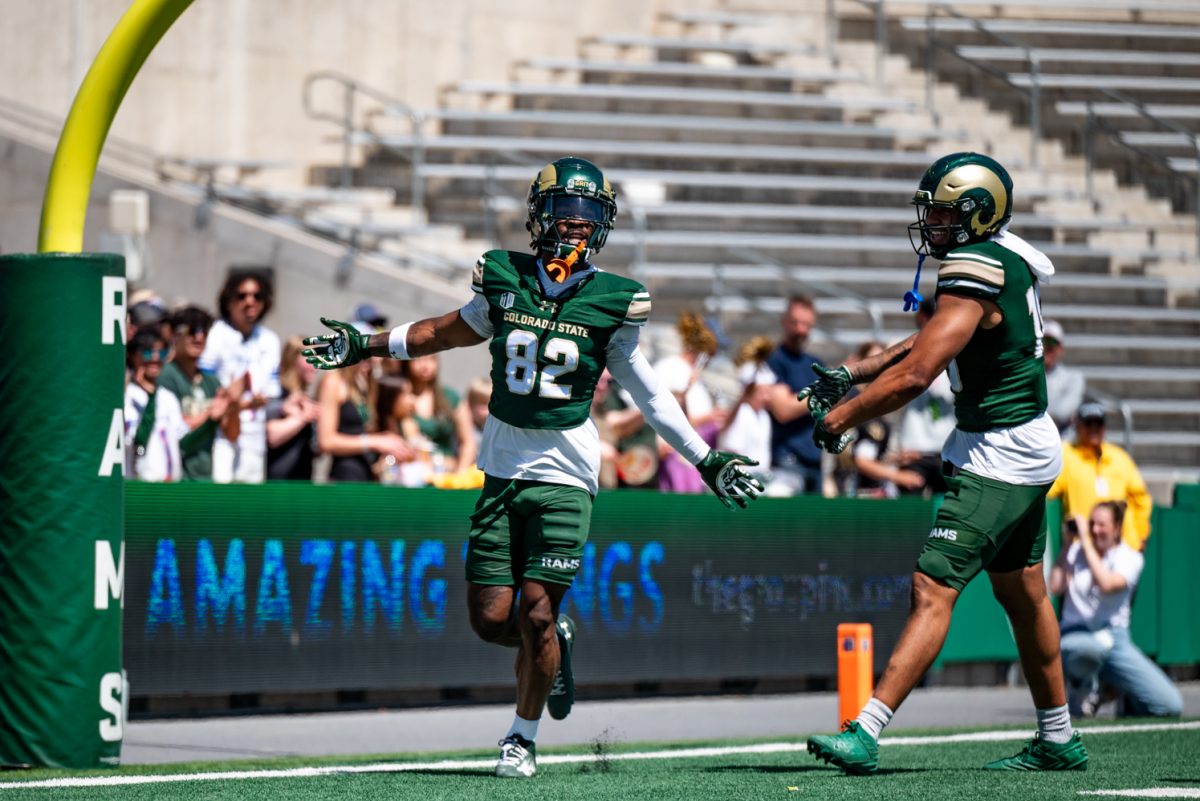 Wide reciever Lavon Brown (82) celebrates a touchdown during a spring football scrimmage April 26.