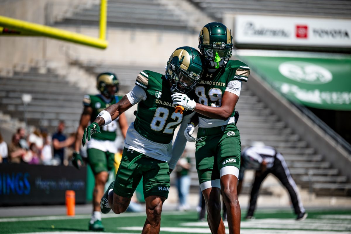 Wide reciever Lavon Brown (82) celebrates a touchdown with wide receiver Keynan Higgins (89) during a spring football scrimmage April 26.