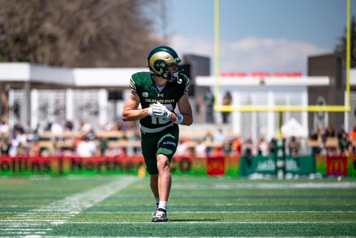 Wide reciever Tommy Maher (10) sets up for a play during a spring scrimmage April 26.