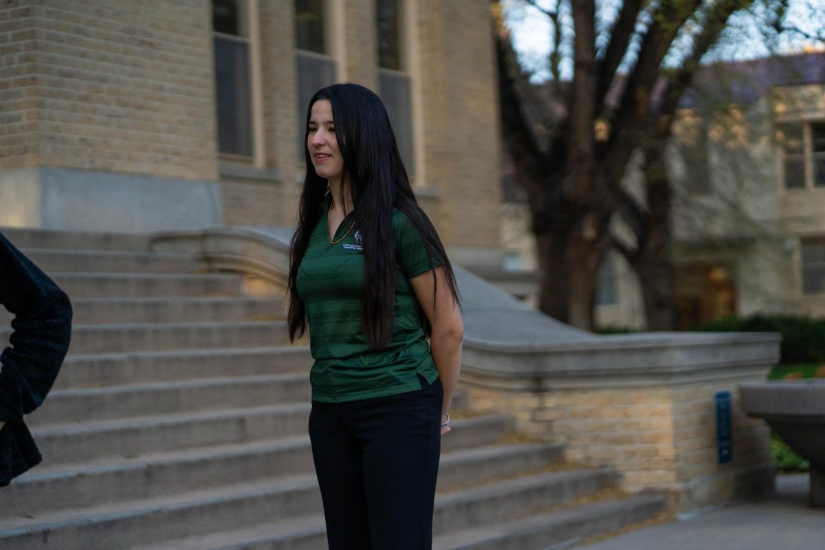 Presidential Ambassador Elena Crooks stands on the steps of the Administration Building before a weekly PA meeting April 29. Crooks is a third year trombone performance and political science major, and a first year PA. 