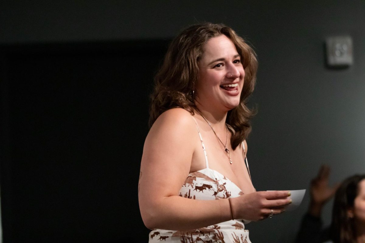 Claudia Bokulich answers questions during her speech at her graduate showcase at the Gregory Allicar Museum of Art in the University Center of the Arts at Colorado State University in Fort Collins Colorado on April 24. "I'm spontaneous with my paintings, I never have a set idea of what my paintings are going to look like." Said Bokulich. Photo taken by Erica Pickering.