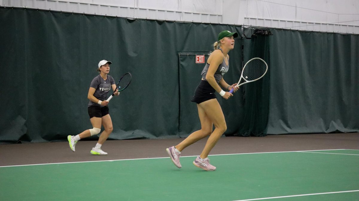 Victoria Erechtchenko (left) and Sarah Weekley (right) follow the ball in their doubles match vs Wyoming 4/13. CSU would lose 4-1 