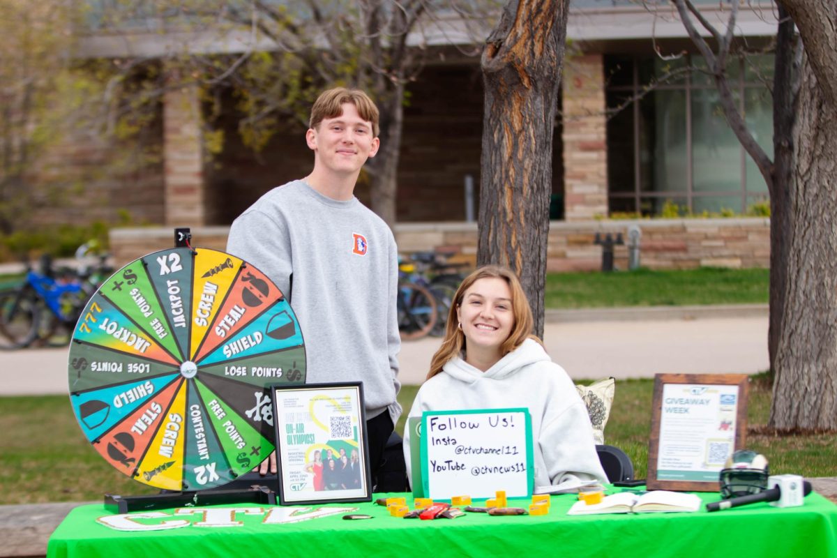 Colorado State University students Bella Walser and Mike Walsh man the student organization CTV table, at the Lory Student Center Plaza at Colorado State University in Fort Collins Colorado on April 24. "Sophomore me could never man this table by myself but no I'm more confident in it." Said Walser. Photo taken by Erica Pickering.
