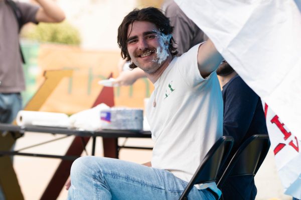 Delta Chi fraternity member Zack Neumann after being pied to support cancer research on the Lory Student Center Plaza at Colorado State University Fort Collins Colorado on April 27. "I enjoy it and I think it's fun now." Said Ethan Valdez. Photo taken by Erica Pickering.