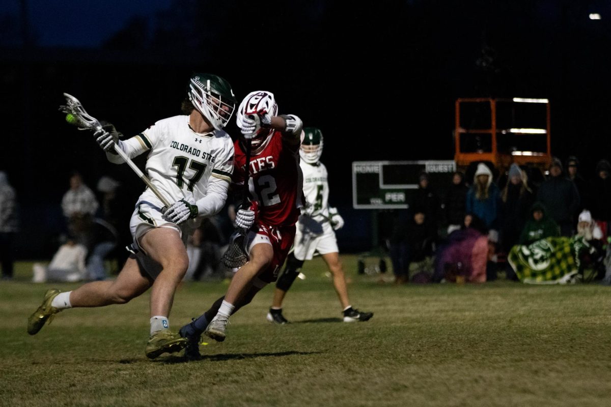 Ethan Scheik attacks the defense in game against University of Utah in Fort Collins Colorado at Colorado State University on April 4. Colorado State University wins 9-4. Photo taken by Erica Pickering.