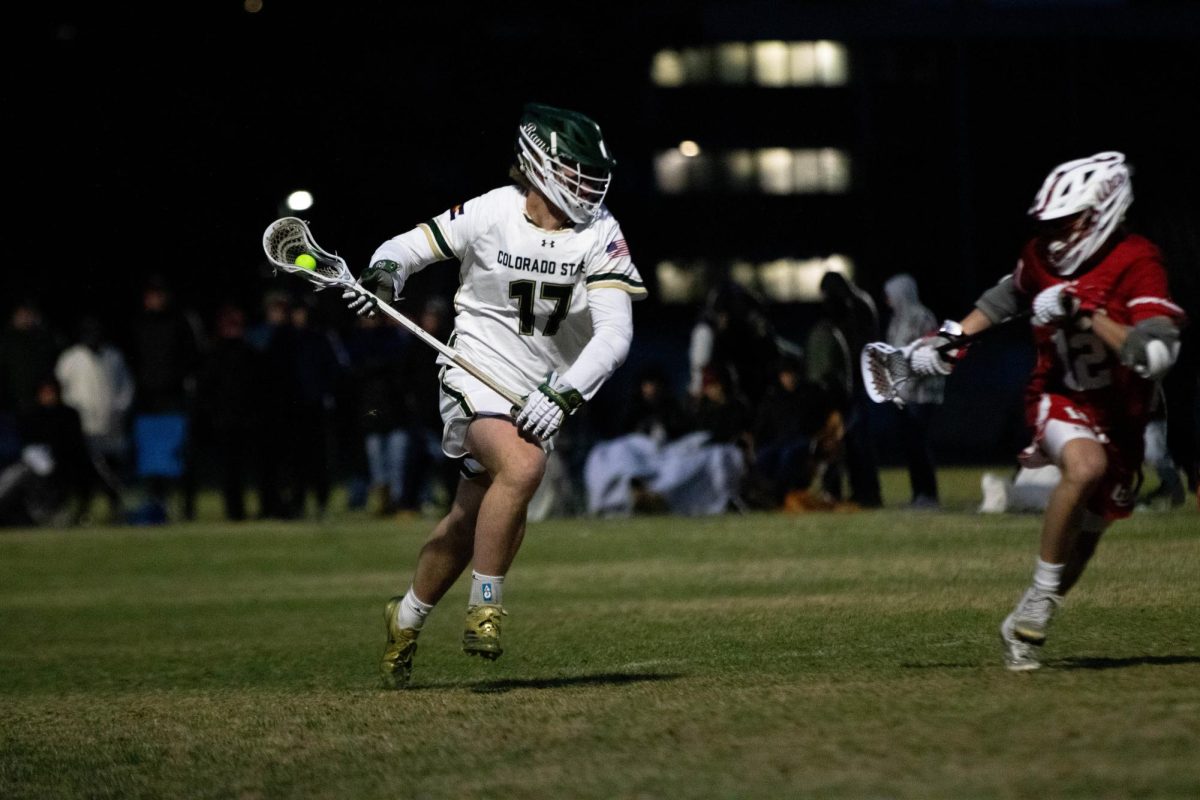 Ethan Scheik races toward the goal in game against University of Utah in Fort Collins Colorado at Colorado State University on April 4. Colorado State University wins 9-4. Photo taken by Erica Pickering.