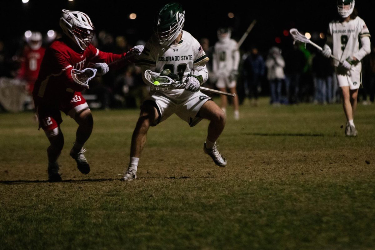 Blake McKinley makes his way past the defense in game against University of Utah in Fort Collins Colorado at Colorado State University on April 4. Colorado State University wins 9-4. Photo taken by Erica Pickering.