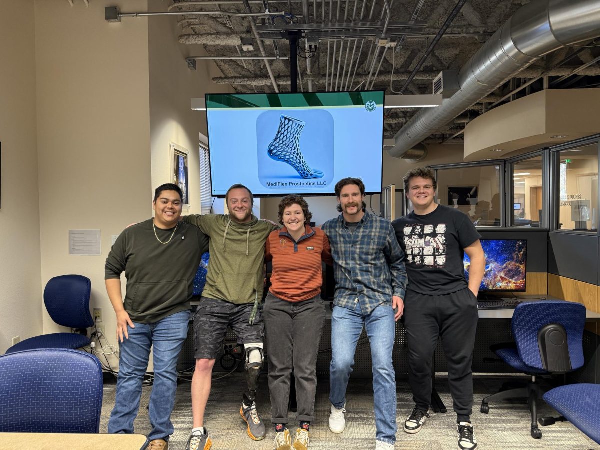 Image of five people standing together.