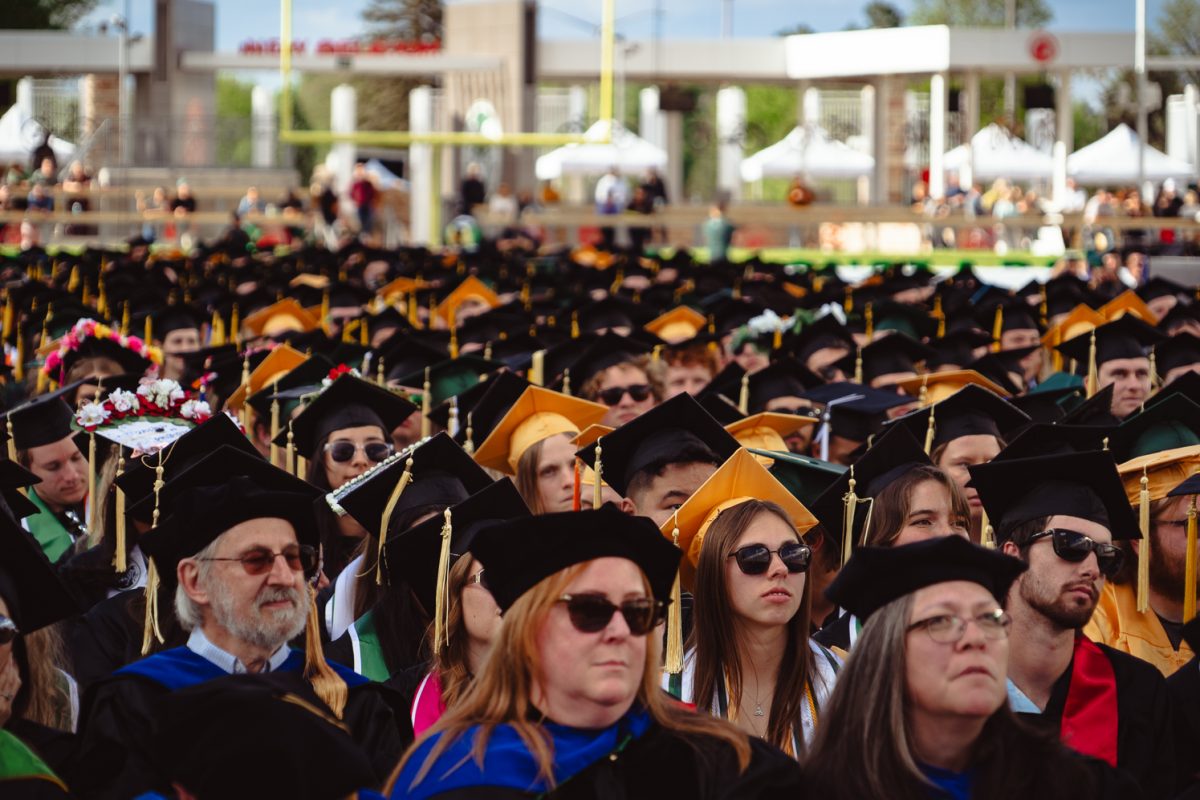 Members of the Colorado State University class of 2025 sit on the field in Canvas Stadium during the universitywide commencement Friday, May 16. 