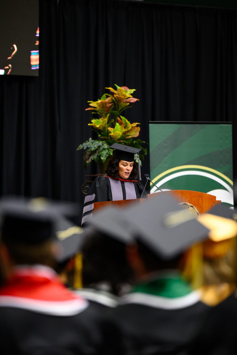 Noa Roman-Muniz introduces the first student speaker of the Agricultural Biology, Horticulture and Landscape Architecture and Soil and Crop Sciences recognition ceremony in Moby Arena May 18.