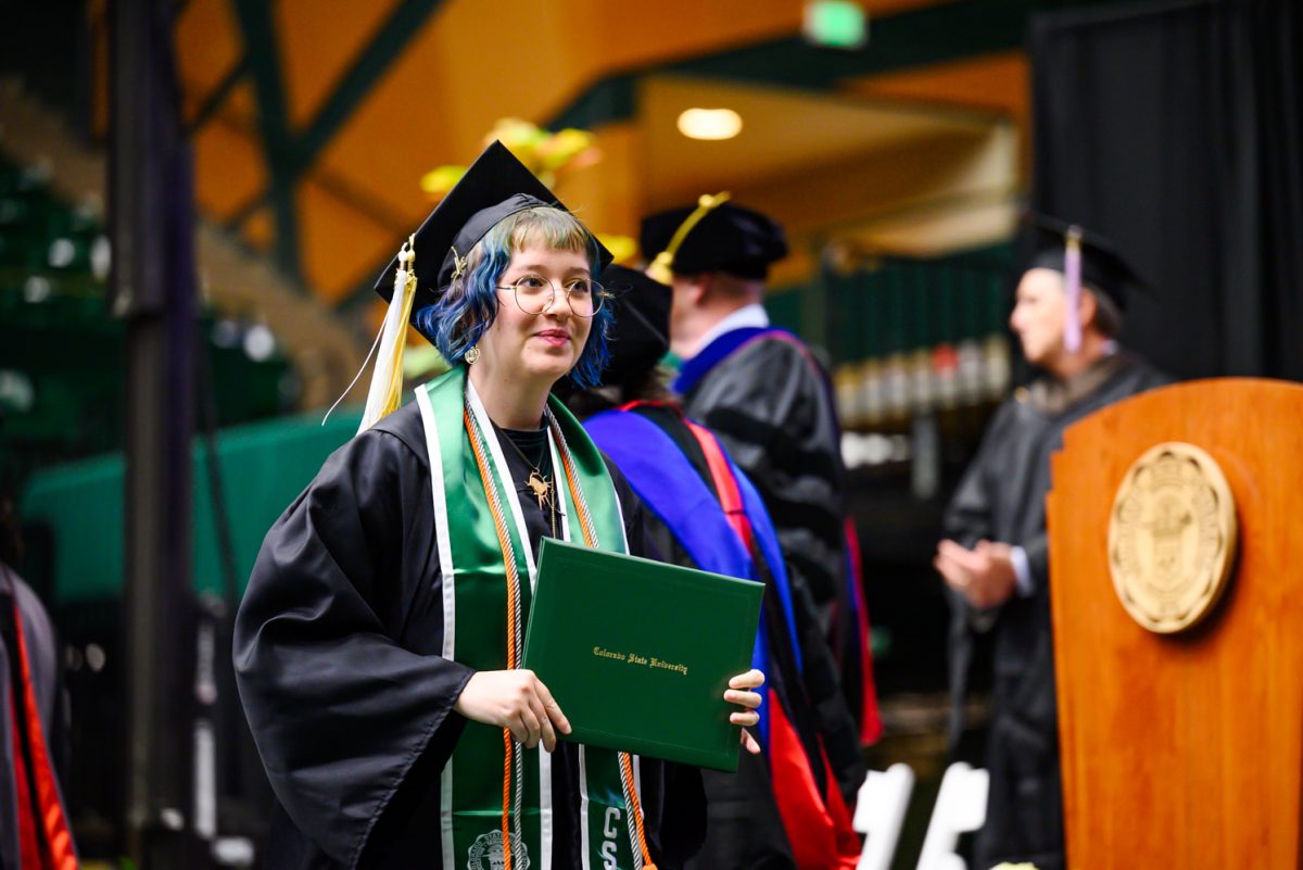 Agricultural biology and fine arts graduate Josie Weese walks off the stage after recieving her diploma during the Agricultural Biology, Horticulture and Landscape Architecture and Soil and Crop Sciences recognition ceremony in Moby Arena May 18.