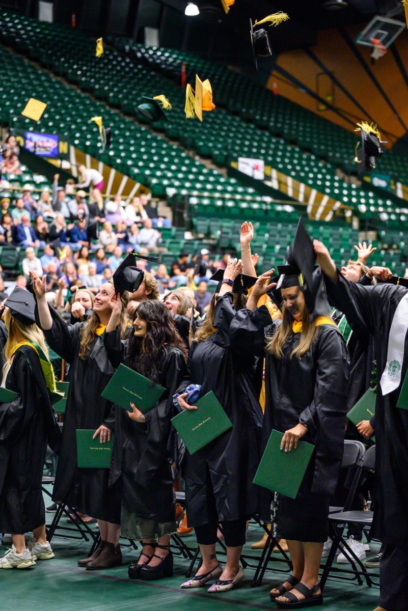 Graduates of Agricultural Biology, Horticulture and Landscape Architecture and Soil and Crop Sciences toss their caps at the end of their recognition ceremony in Moby Arena May 18.