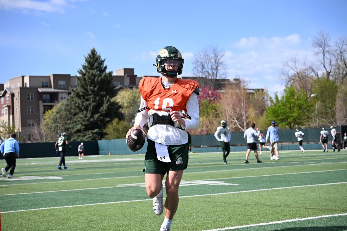 Brayden Fowler-Nicolosi (16) looks for a receiver during a Colorado State University football Spring camp practice April 24.