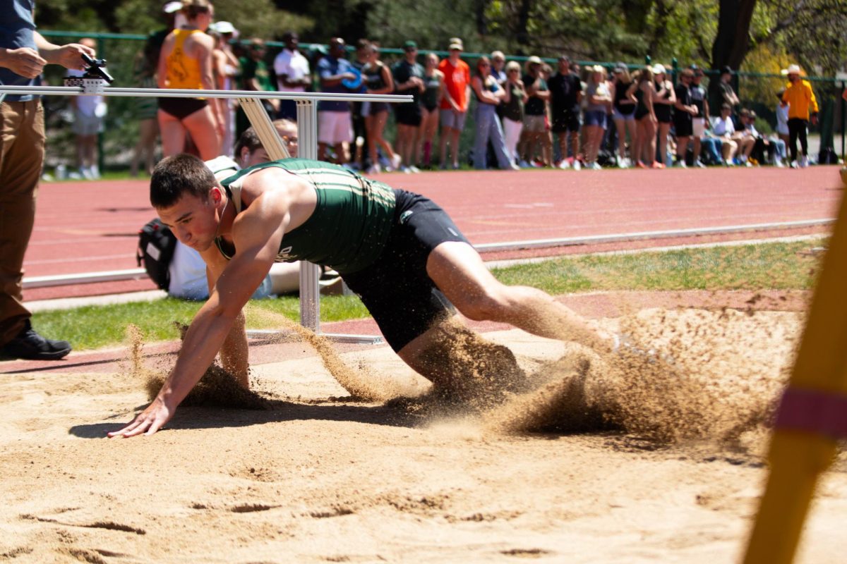 Zach Sell lands in the sand during the long jump during the Doug Max Invitational track meet at Colorado State University in Fort Collins Colorado on May 3. Photo taken by Erica Pickering.