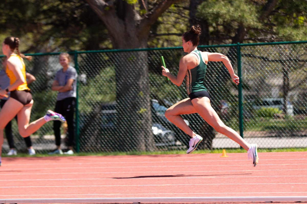 Lily Krob sprints during the 4x100 meter realy during the Doug Max Invitational track meet at Colorado State University in Fort Collins Colorado on May 3. Photo taken by Erica Pickering.
