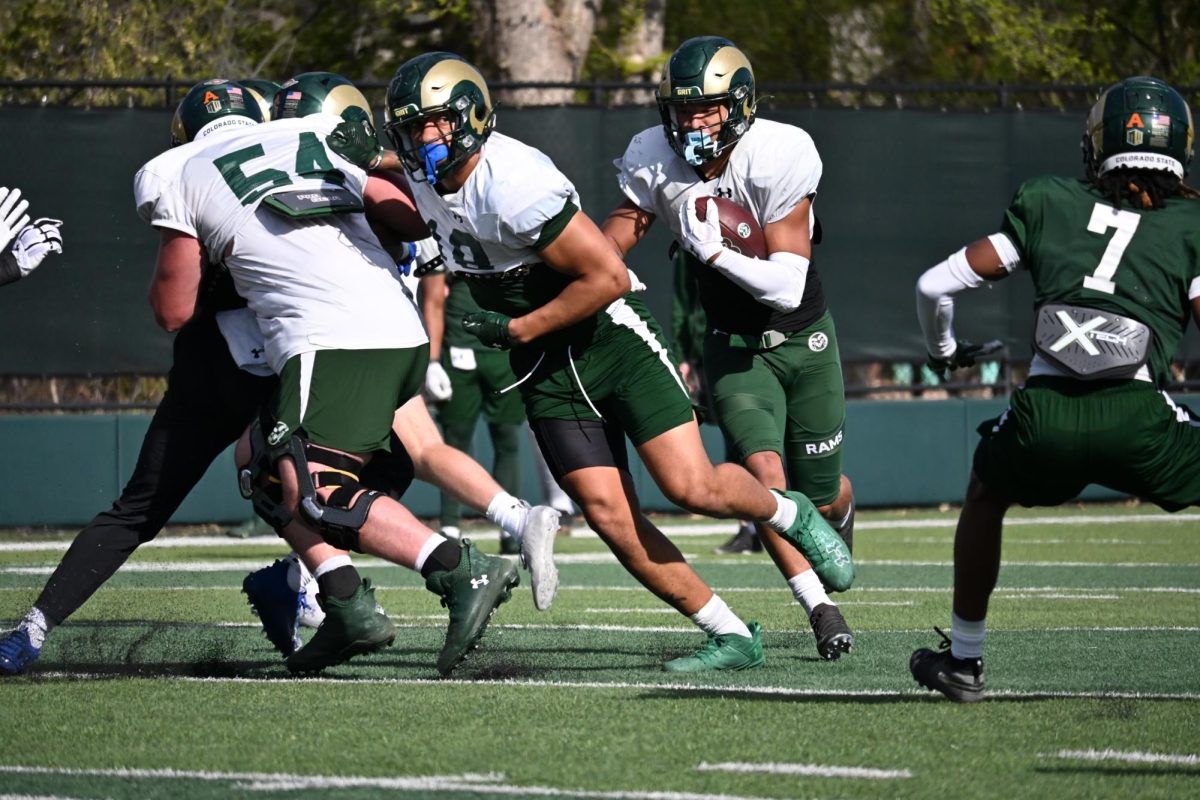 Jalen Dupree (2) follows a lead blocker during a Colorado State University football Spring camp practice April 24.