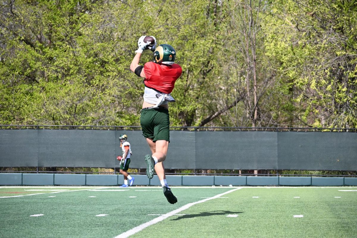 Jaxxon Warren (19) high-points a ball during a Colorado State University football Spring camp practice April 24.