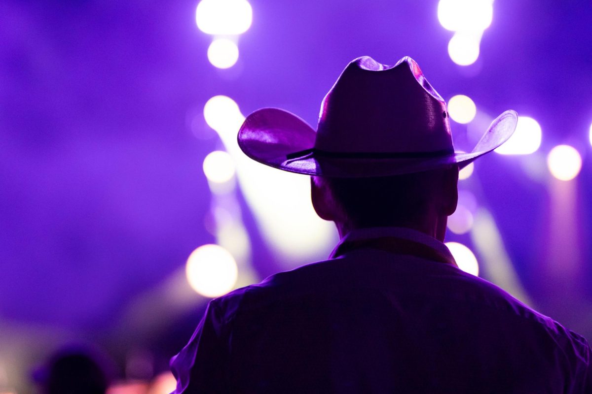 A spectator enjoys the live music at PBR's Last Cowboy Standing event at Colorado State University's Canvas Stadium in Fort Collins Colorado on July 21, 2025. Photo taken by Erica Pickering