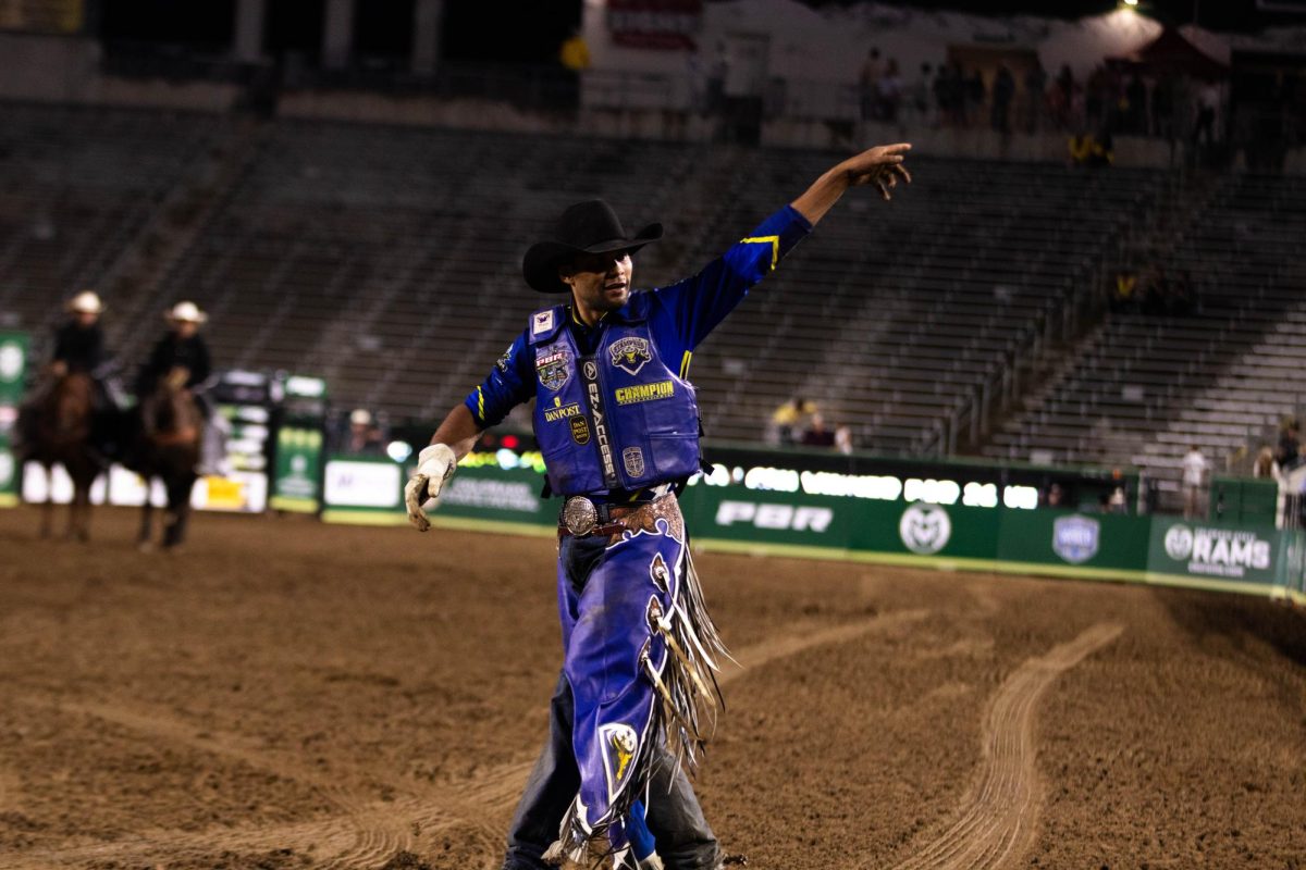 Pro bull rider Alan De Souza celebrates his ride during the final night of PBR's Last Cowboy Standing in Fort Collins Colorado in Colorado State University's Canvas Stadium on July 22 2025. Photo taken by Erica Pickering.