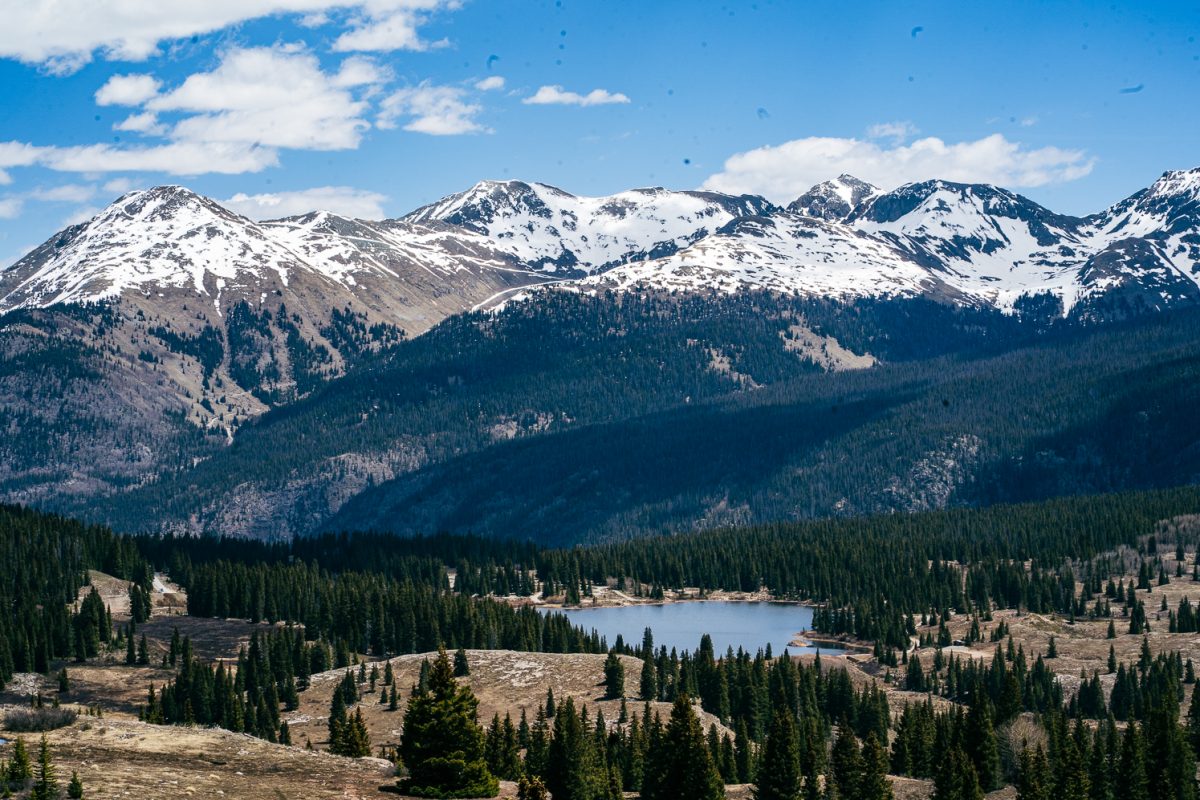 Mount Rhoda towers over Molas Lake in the San Juan Mountain range in southwestern Colorado May 22. Molas Pass marks one of the final mountain passes before reaching the historic mining town of Silverton, Colorado. The region is marked by remote snowcapped peaks, contrasting against the red and yellow rocks, remnants of the boom in mining from Colorado's gold rush. 