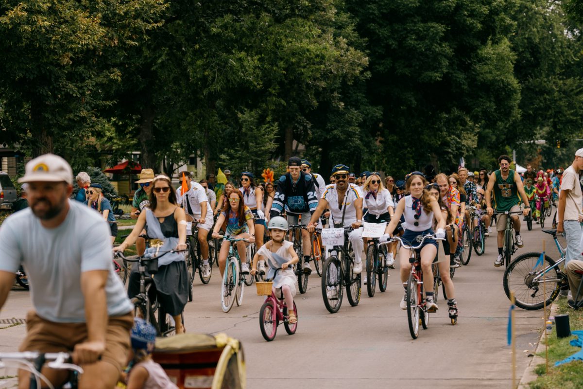 Costumed cyclists bike down Mountain Avenue during New Belgium Brewing Company's annual Tour de Fat bike festival Aug. 23.