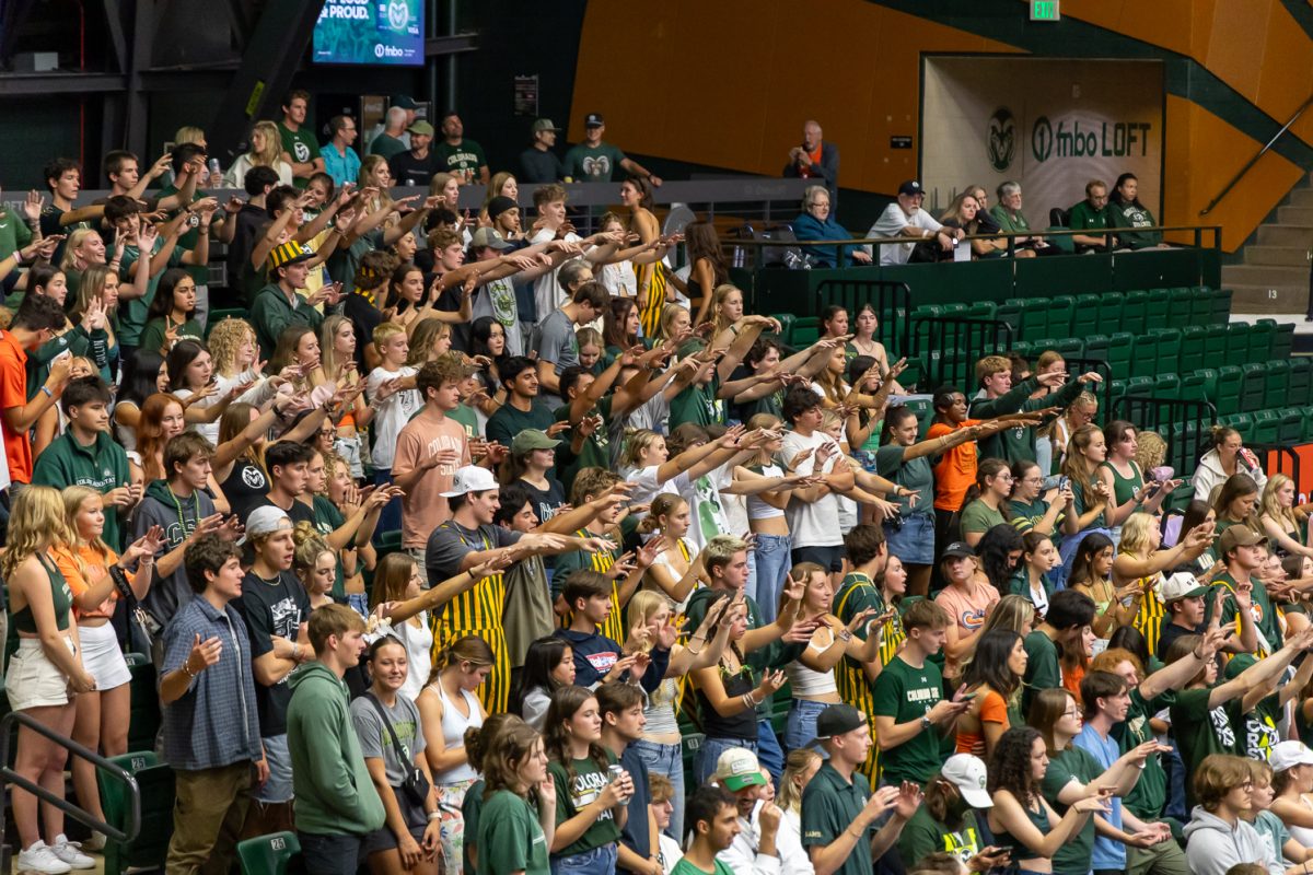 Colorado State University students shimmy their fingers, sending good luck and good vibes to the CSU volleyball team before a serve Aug. 29. CSU played Colgate University in Moby Arena and won 3-0.