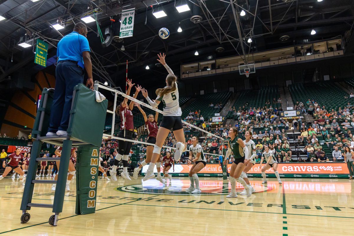 Colorado State University Women's Volleyball player Sofia Zabjek jumps to hit the ball over the net and past Colgate's attempt at blocking the ball. CSU played in Moby Arena and won, 3-0. Aug. 29.