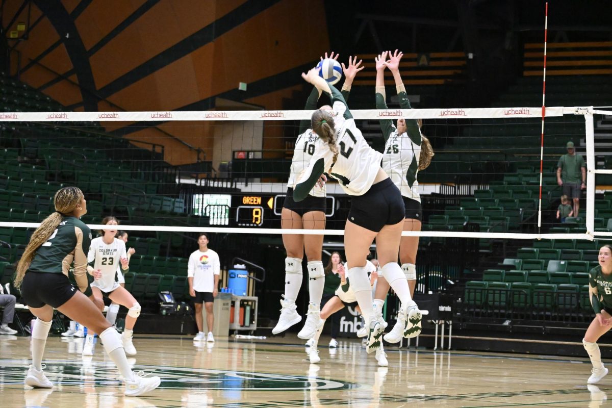 Eve Wilson (27) spikes the ball in Colorado State University volleyball's Green and Gold Scrimmage Aug. 23. CSU's first game will be against Colgate Aug. 29. 