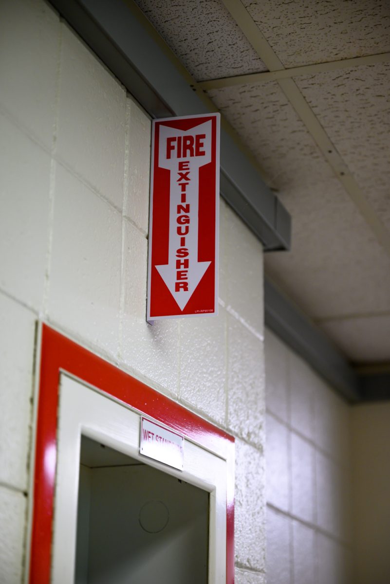 A fire extinguisher label hangs on the wall in the Clark C building Sept. 2.