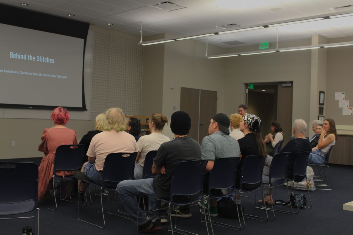 Attendees at the curator talk engage with Evans before her talk in the Avenir Museum. 
Sept. 4. Her exhibition, "Dear Old Coat: Sentiment, Stewardship, Sustainability" will be on display in the Avenir Museum of Design and Merchandising’s Richard Blackwell Gallery until December 20th, 2025. 