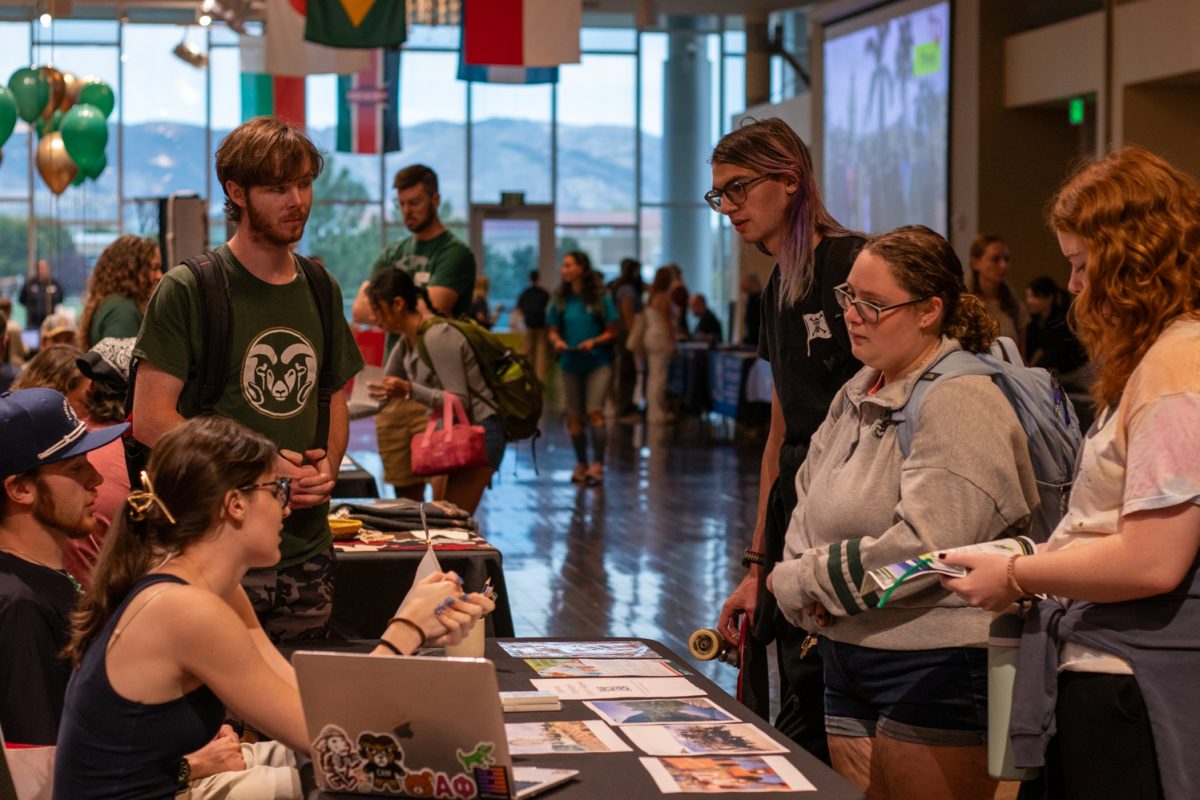 Students visit various booths during the Education Abroad fair at the Lory Student Center ballroom at Colorado State University Sept. 12.
