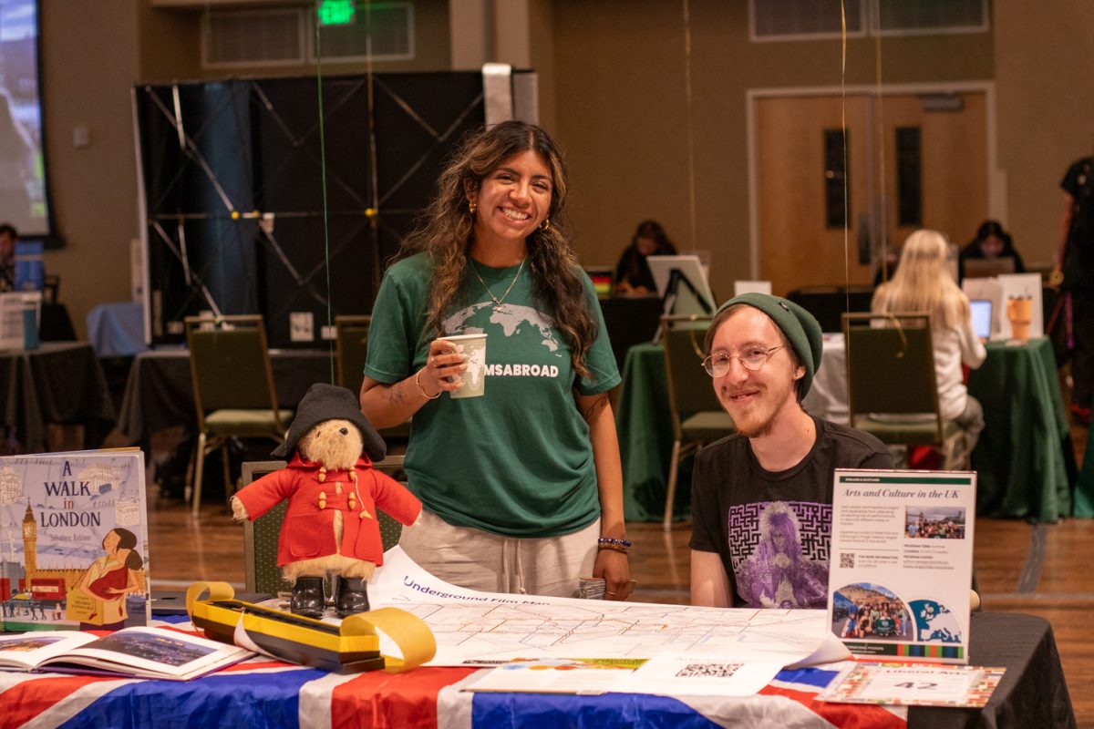 Kayla Ybarra and Zach Taylor stand at the Arts and Culture in the UK booth during the Education Abroad fair at the Lory Student Center ballroom at Colorado State University on Sept. 12, 2025. Taylor, who recently studied abroad, recalled his time there in the United Kingdom as "fully life changing."